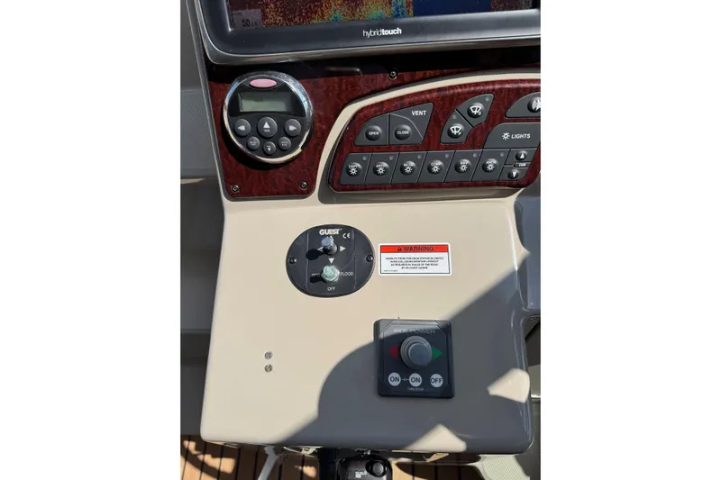  Yacht Photos Pics Control panel of a 2008 Sea Ray 330 Sundancer boat with various switches and dials.