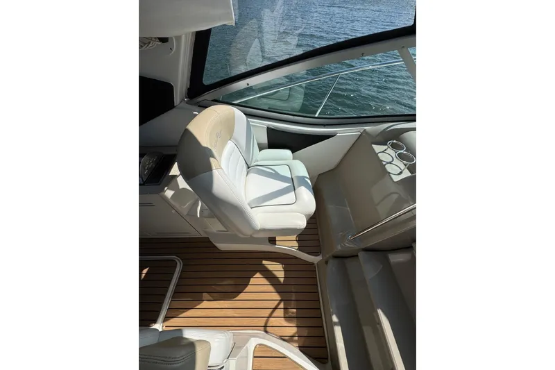  Yacht Photos Pics 2008 Sea Ray 330 Sundancer cockpit with white seating and wooden flooring.