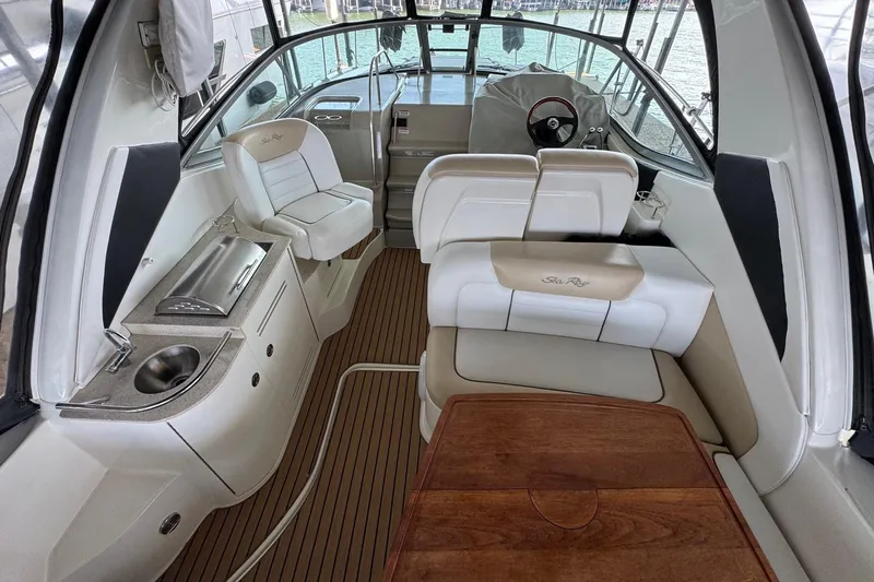  Yacht Photos Pics 2008 Sea Ray 330 Sundancer interior with seating, helm, and kitchenette.