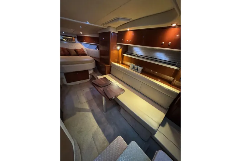  Yacht Photos Pics Luxurious interior of 2008 Sea Ray 330 Sundancer yacht with cozy seating and elegant design.