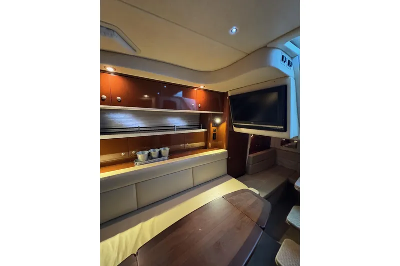  Yacht Photos Pics Luxurious interior of 2008 Sea Ray 330 Sundancer yacht with cozy seating and modern amenities.