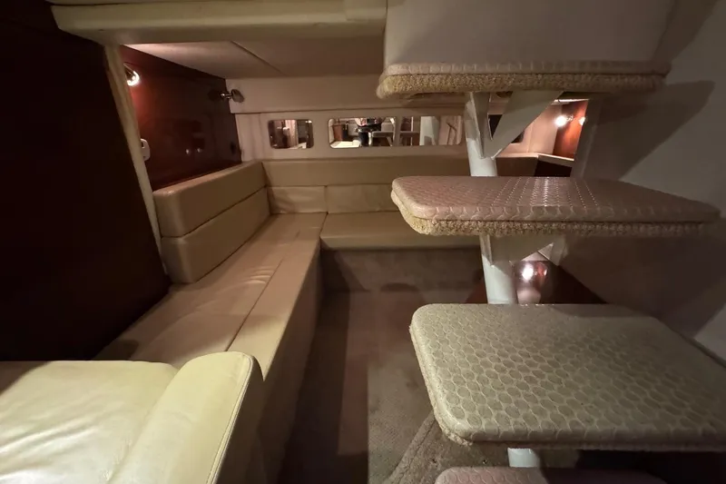  Yacht Photos Pics 2008 Sea Ray 330 Sundancer interior with beige seating and carpeted steps.