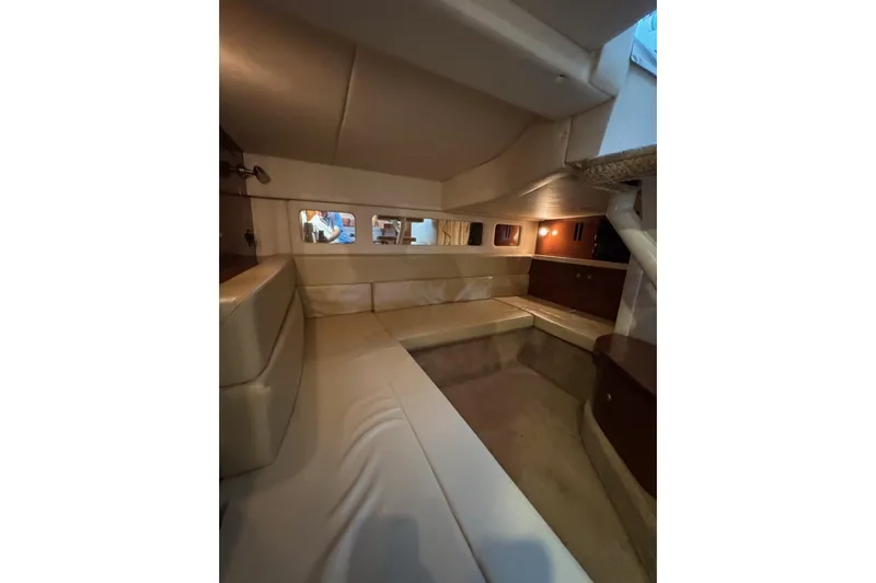  Yacht Photos Pics 2008 Sea Ray 330 Sundancer cabin interior with beige seating and wooden accents.