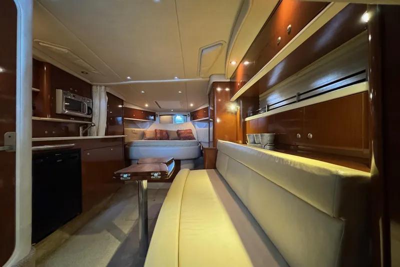  Yacht Photos Pics Luxurious interior of 2008 Sea Ray 330 Sundancer yacht with cozy seating and modern amenities.