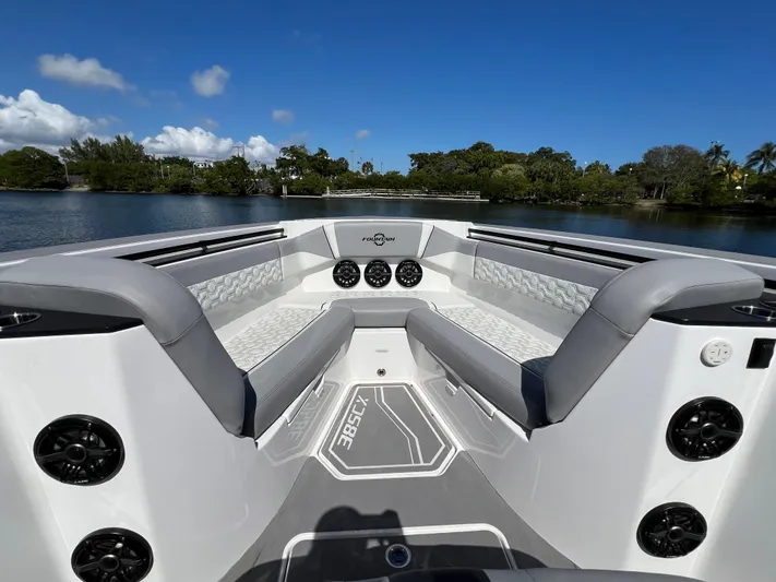  Yacht Photos Pics 2023 Fountain 38 SCX boat interior with luxurious seating and scenic water view.