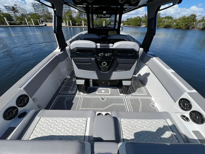  Yacht Photos Pics 2023 Fountain 38 SCX boat interior with modern seating and sleek design on the water.