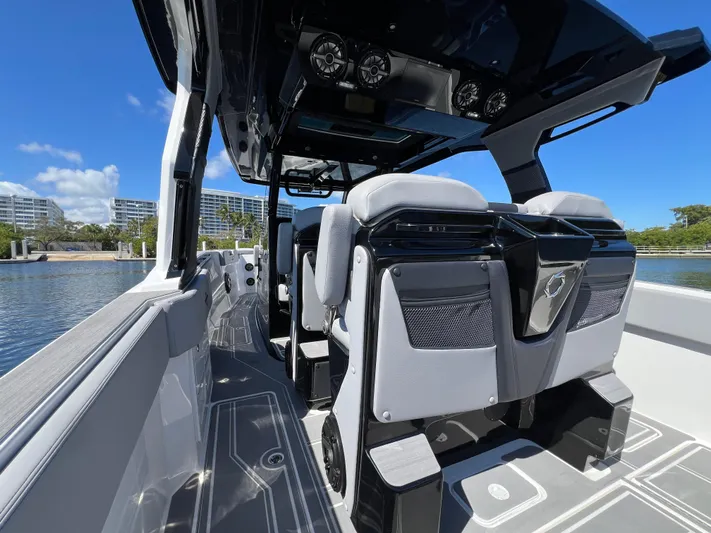  Yacht Photos Pics 2023 Fountain 38 SCX boat interior with modern seating and sleek design.
