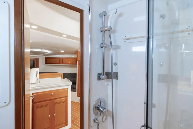 Miss Big Gun Yacht Photos Pics Interior of 2000 Cabo 35 Express yacht featuring shower and cabin area.