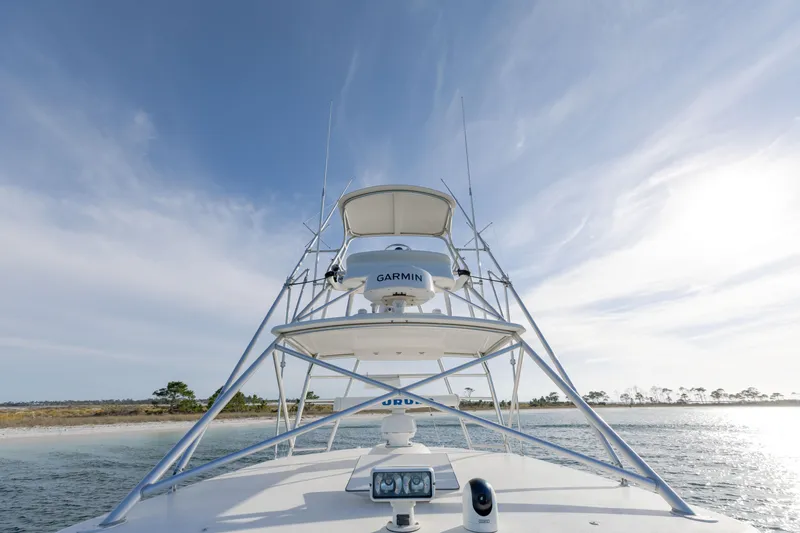 Miss Big Gun Yacht Photos Pics Cabo 35 Express 2000 boat with Garmin equipment on open water under blue sky.