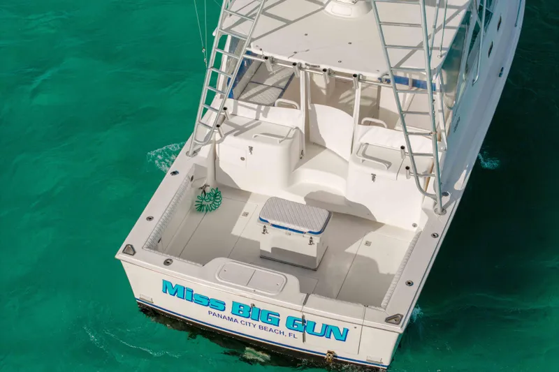 Miss Big Gun Yacht Photos Pics 2000 Cabo 35 Express boat on turquoise water, Panama City Beach, FL.