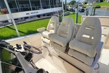  Yacht Photos Pics 2022 Grady-White Canyon 336 boat interior with plush seating and steering wheel.