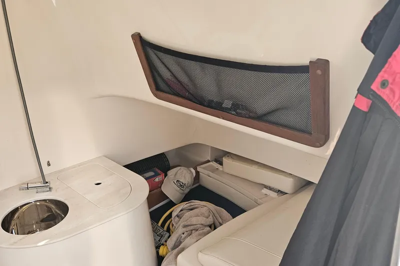  Yacht Photos Pics 2022 Grady-White Canyon 336 cabin interior with storage and seating area.