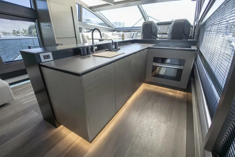 Pearl 72 Indulgence Yacht Photos Pics Luxurious modern kitchen interior on Pearl 72 yacht, 2025 model, featuring sleek design and ambient lighting.
