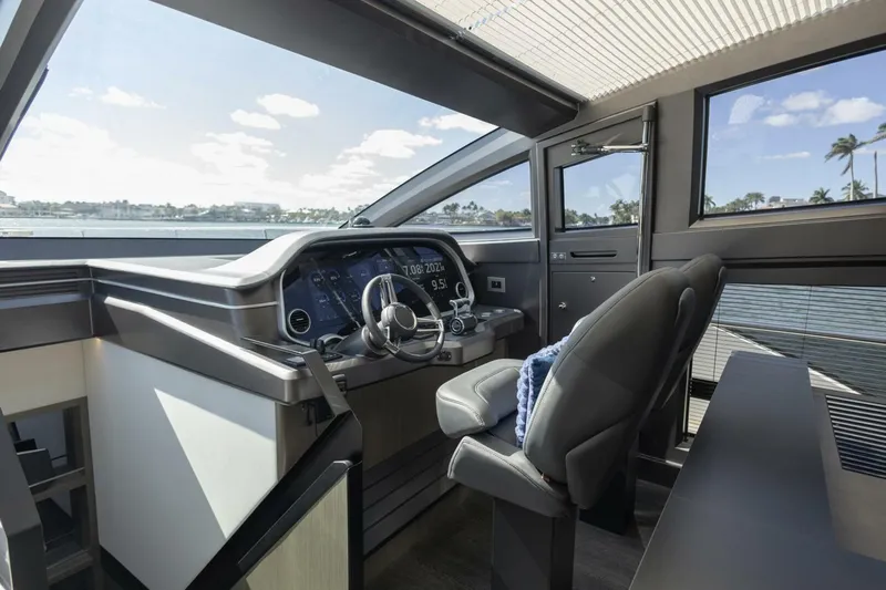 Pearl 72 Indulgence Yacht Photos Pics Luxurious interior of 2025 Pearl 72 yacht with modern helm and panoramic windows.