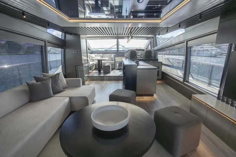 Pearl 72 Indulgence Yacht Photos Pics Luxurious interior of 2025 Pearl 72 yacht with modern furnishings and panoramic windows.