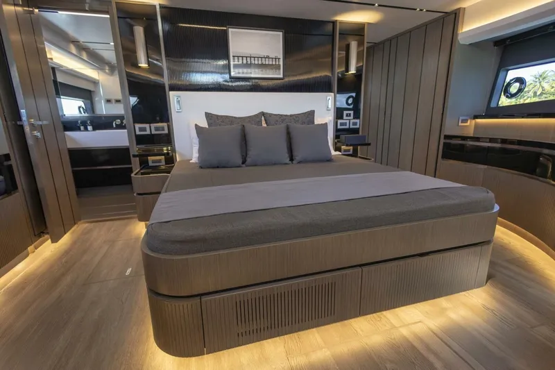 Pearl 72 Indulgence Yacht Photos Pics Luxurious bedroom interior of 2025 Pearl 72 yacht with modern design and ambient lighting.