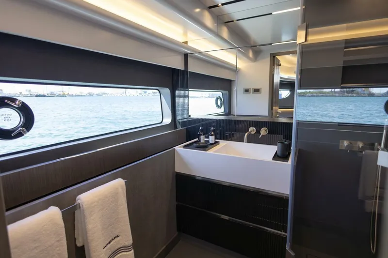 Pearl 72 Indulgence Yacht Photos Pics Luxurious bathroom interior of 2025 Pearl 72 yacht with ocean view.