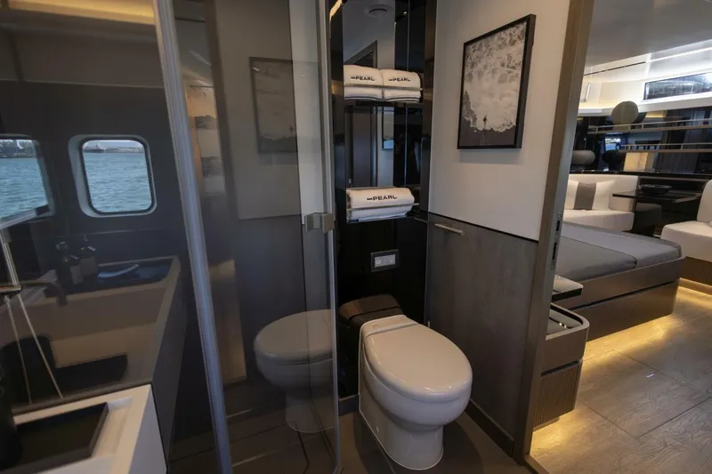 Pearl 72 Indulgence Yacht Photos Pics Luxurious interior of 2025 Pearl 72 yacht featuring modern bathroom and elegant living space.