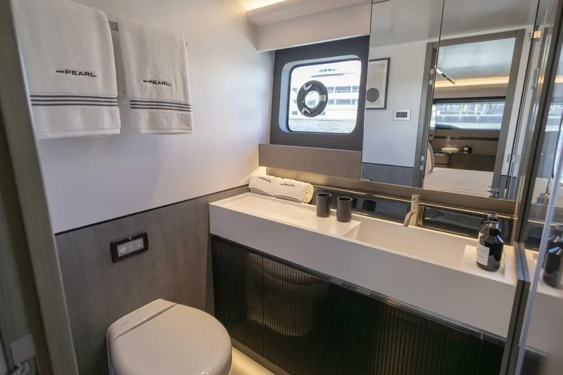 Pearl 72 Indulgence Yacht Photos Pics Luxurious bathroom in 2025 Pearl 72 yacht with modern fixtures and elegant design.