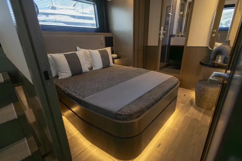 Pearl 72 Indulgence Yacht Photos Pics Luxurious bedroom interior in 2025 Pearl 72 yacht, featuring modern design and ambient lighting.