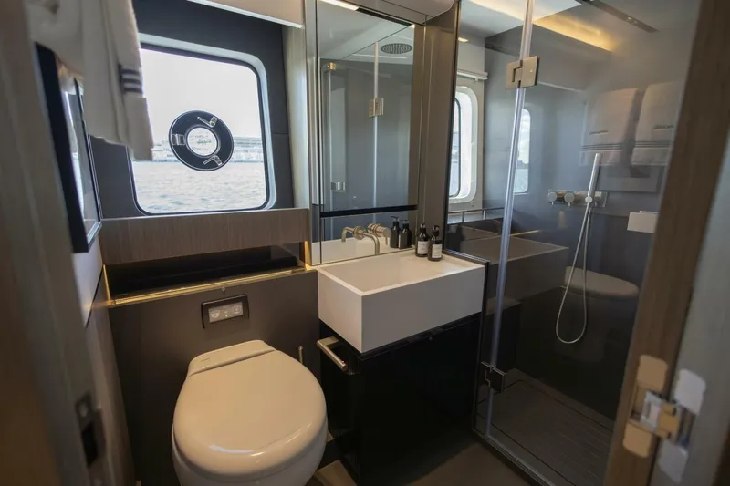 Pearl 72 Indulgence Yacht Photos Pics Luxurious bathroom in 2025 Pearl 72 yacht with modern fixtures and ocean view.