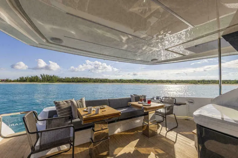 Pearl 72 Indulgence Yacht Photos Pics Luxurious Pearl 72 yacht deck with seating, table, and ocean view, 2025 model.