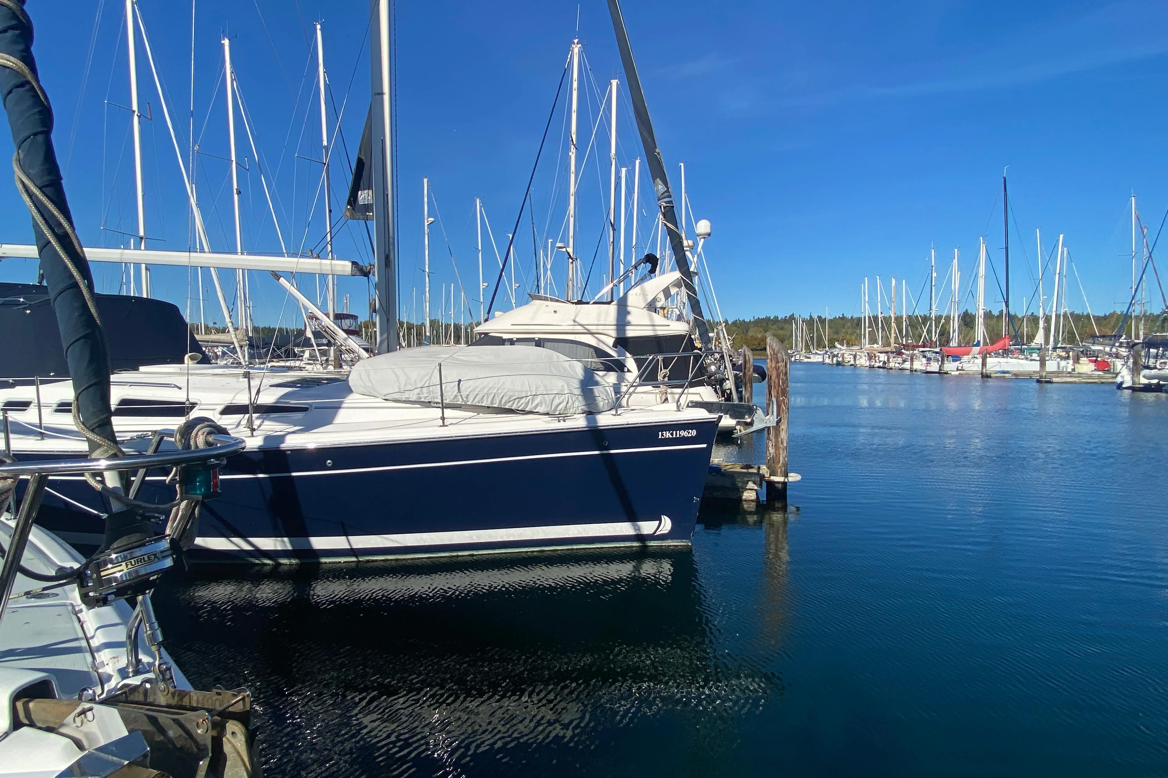 2006 Hunter 38 sailboat docked in marina.
