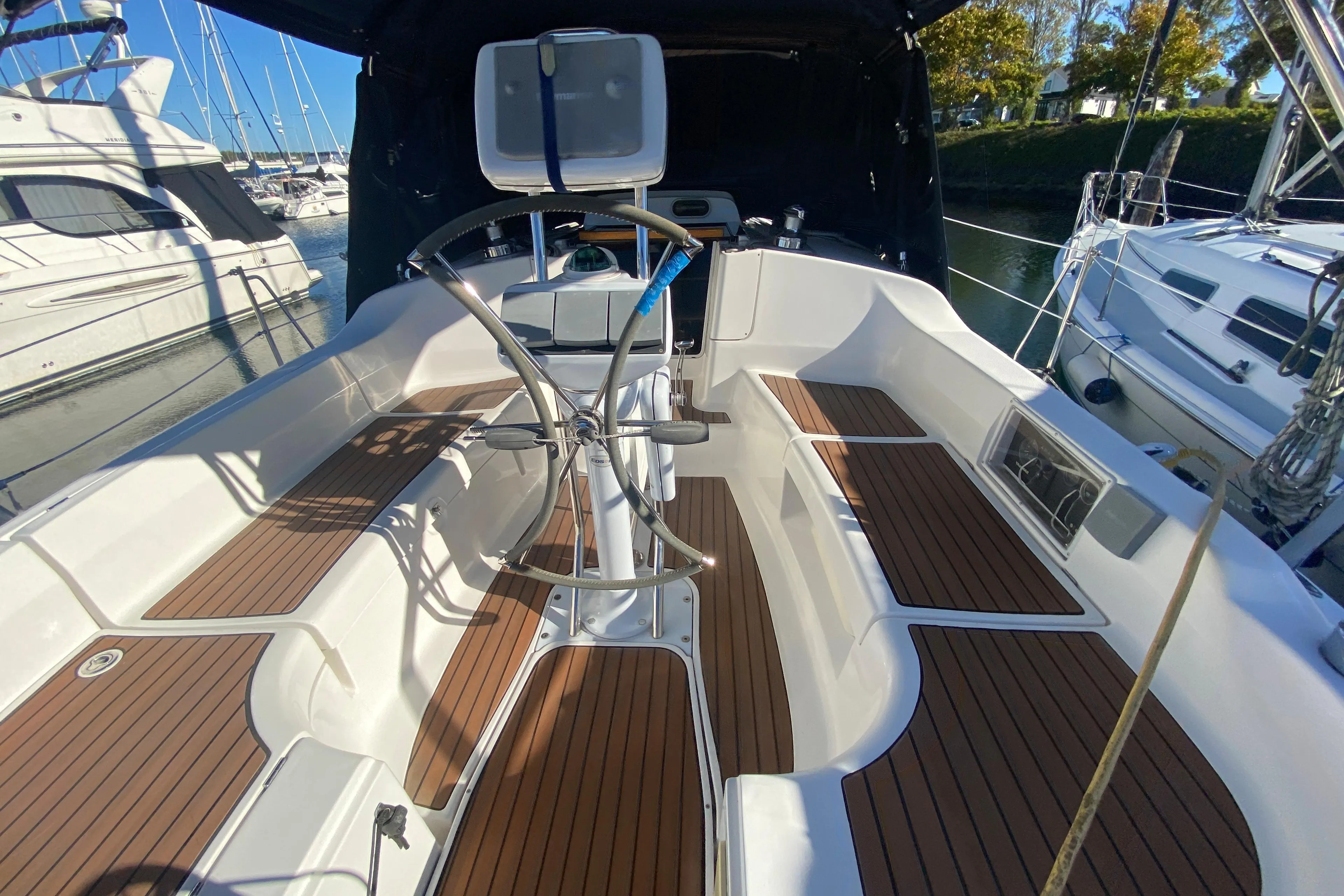 Cockpit of a 2006 Hunter 38 yacht with wooden decks.