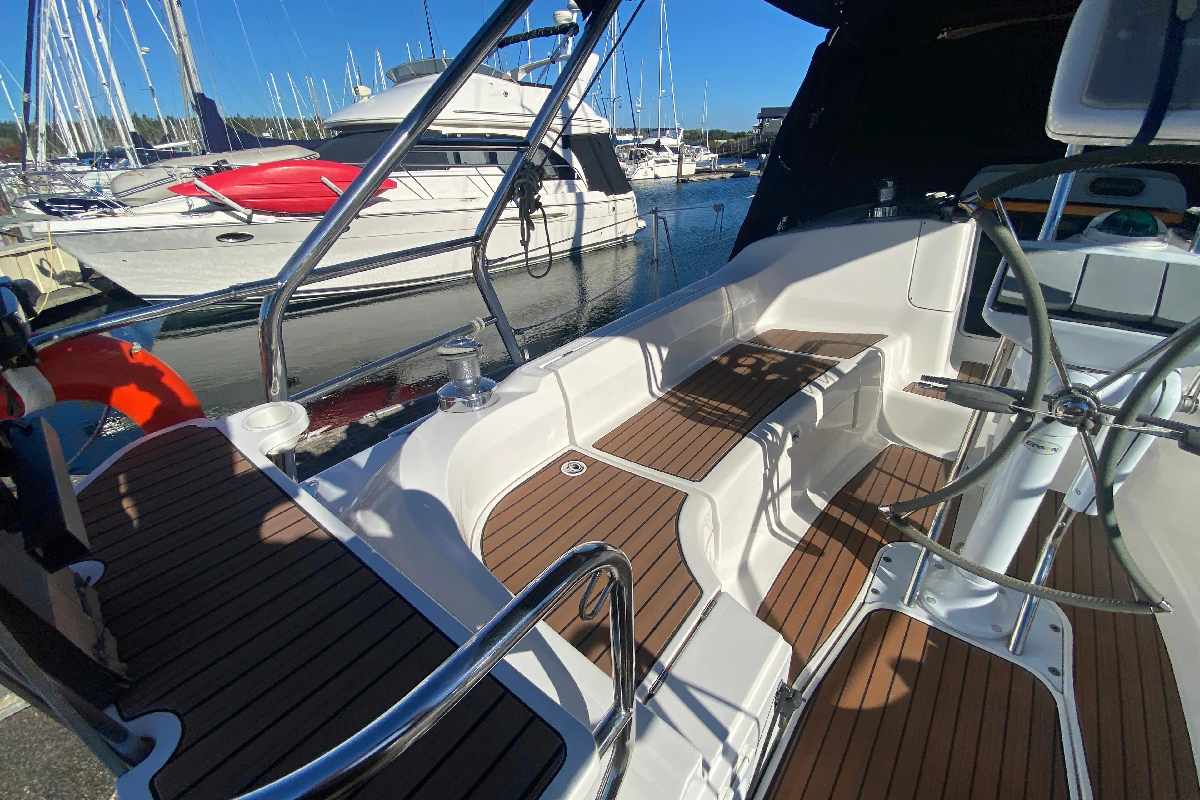 Hunter 38 sailboat cockpit, 2006 model, docked at marina.