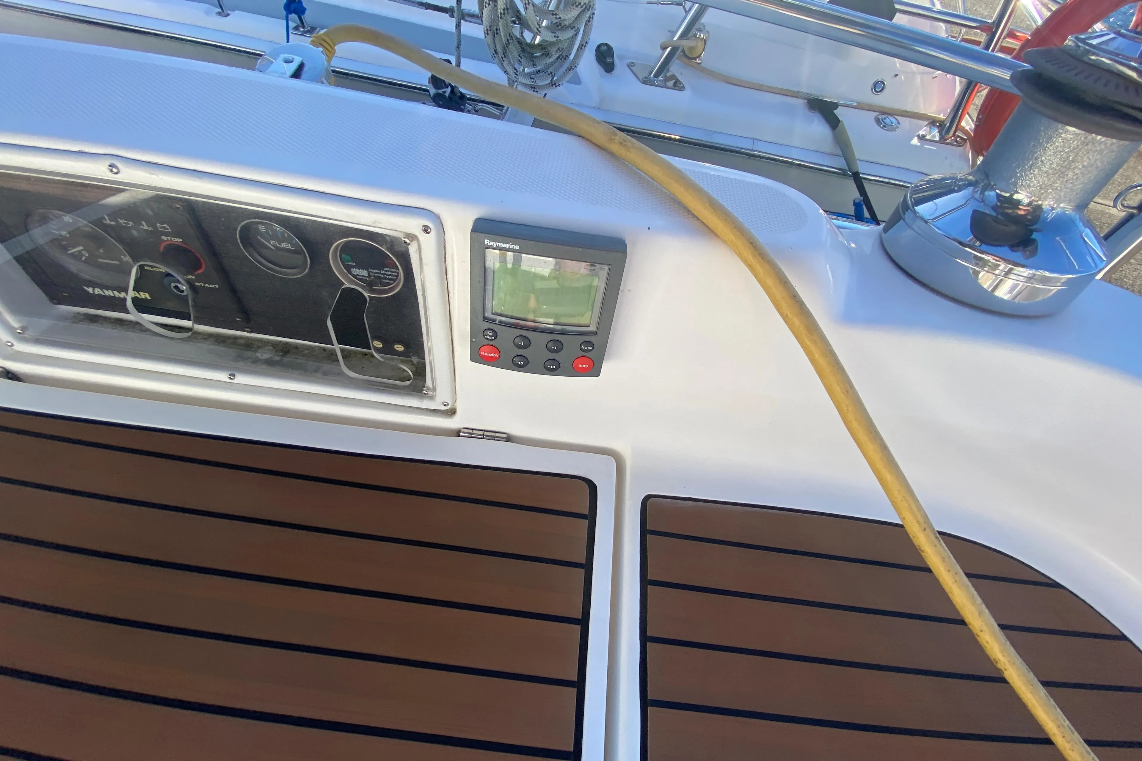 Cockpit of a 2006 Hunter 38 sailboat with instrument panel.