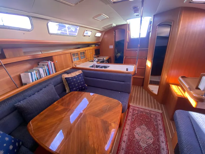 First Admiral Yacht Photos Pics Interior of a 2006 Hunter 38 yacht with wooden furnishings.