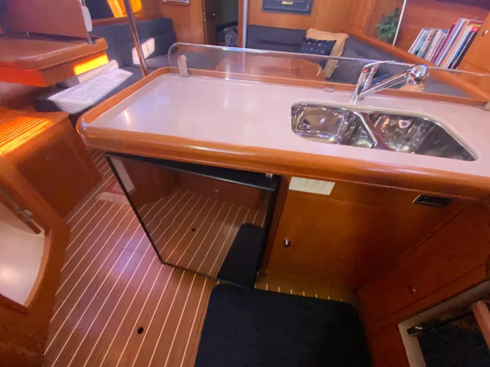 First Admiral Yacht Photos Pics Interior of a 2006 Hunter 38 yacht featuring a modern kitchen.