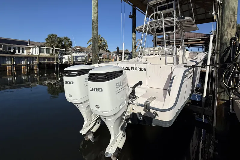 Hooked On A Feeling Yacht Photos Pics 2005 Grady-White Bimini 306 boat with dual 300 horsepower engines docked in Florida.
