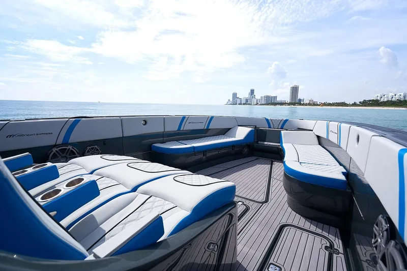  Yacht Photos Pics 2020 Midnight Express 43' Open boat with luxurious seating, ocean view, and city skyline.