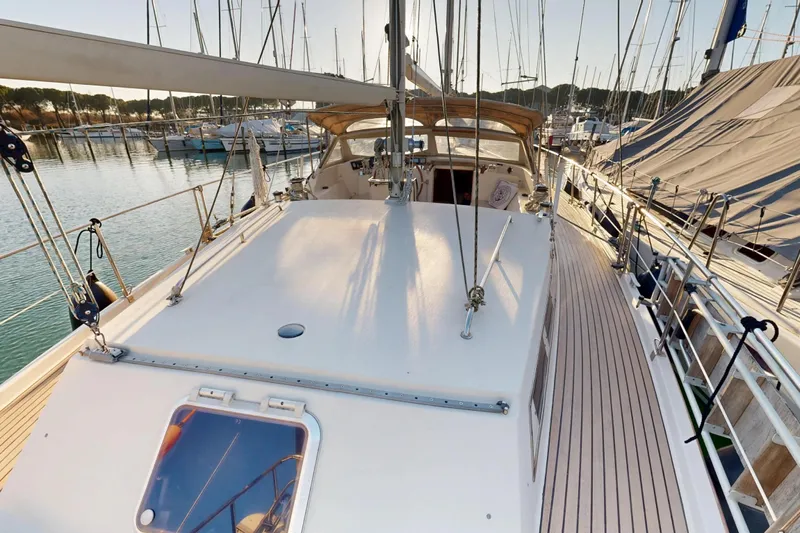  Yacht Photos Pics 2002 Amel Super Maramu 2000 sailboat deck view in marina at sunset.