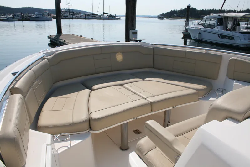  Yacht Photos Pics Luxurious seating on 2018 Pursuit S 328 Sport boat docked at marina.