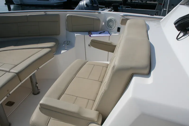  Yacht Photos Pics 2018 Pursuit S 328 Sport boat with beige seating and cup holders.