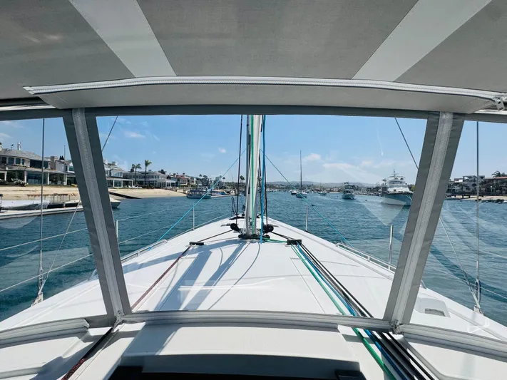 Happy Hour Yacht Photos Pics Beneteau Oceanis 41.1 sailboat, 2020 model, cruising in a scenic coastal harbor.