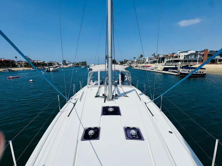Happy Hour Yacht Photos Pics Beneteau Oceanis 41.1 sailboat cruising in a scenic harbor, 2020 model.