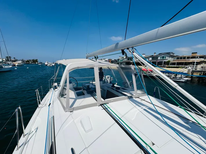 Happy Hour Yacht Photos Pics Beneteau Oceanis 41.1 sailboat, 2020 model, docked in a sunny marina.
