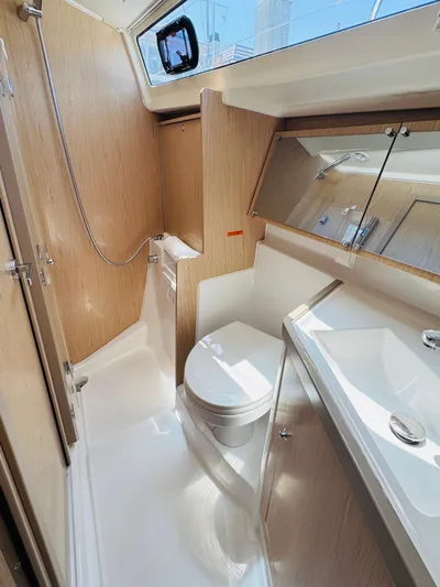Happy Hour Yacht Photos Pics 2020 Beneteau Oceanis 41.1 yacht bathroom with modern fixtures and wood accents.