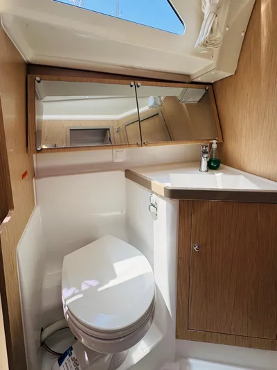 Happy Hour Yacht Photos Pics Beneteau Oceanis 41.1 2020 yacht bathroom with wooden cabinetry and skylight.