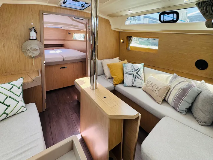 Happy Hour Yacht Photos Pics Interior of 2020 Beneteau Oceanis 41.1 yacht, featuring cozy seating and stylish decor.