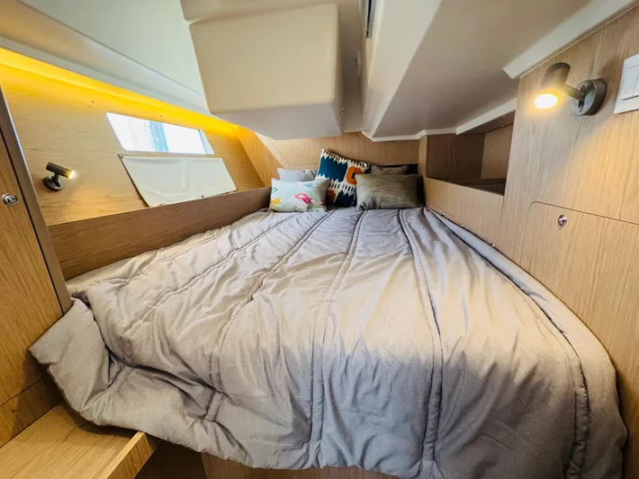 Happy Hour Yacht Photos Pics Cozy cabin interior of 2020 Beneteau Oceanis 41.1 sailboat with comfortable bedding.