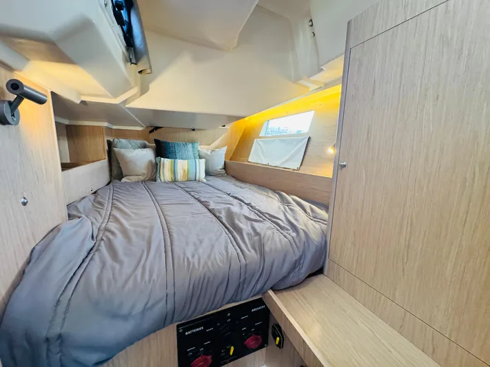 Happy Hour Yacht Photos Pics Cozy cabin interior of 2020 Beneteau Oceanis 41.1 sailboat with comfortable bedding.