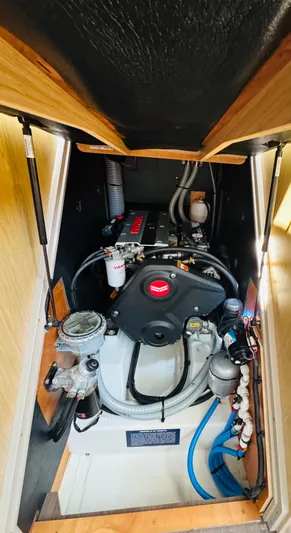 Happy Hour Yacht Photos Pics Engine compartment of a 2020 Beneteau Oceanis 41.1 sailboat, showcasing mechanical components.