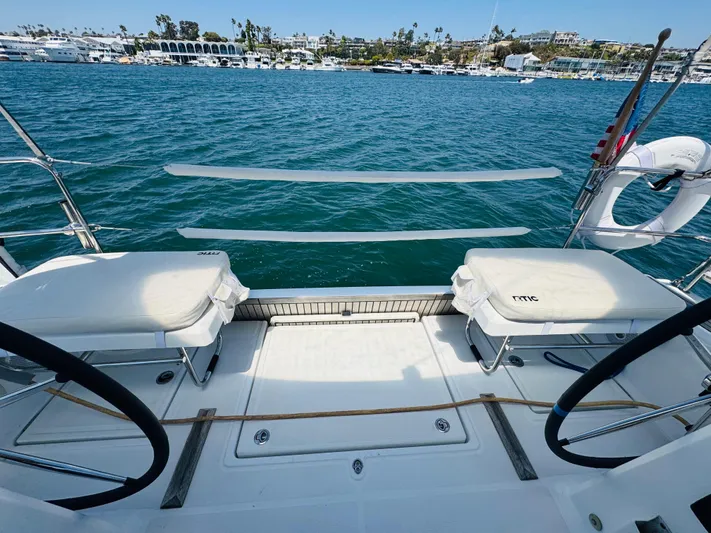 Happy Hour Yacht Photos Pics Beneteau Oceanis 41.1 sailboat deck, 2020 model, overlooking marina and calm blue waters.