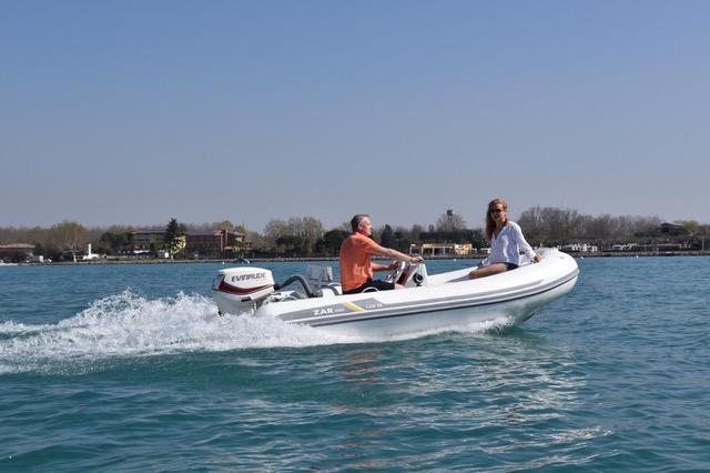 2023 ZAR Mini LUX 12 boat cruising on a sunny day.