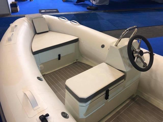 2023 ZAR Mini LUX 12 inflatable boat interior with steering wheel and seating.