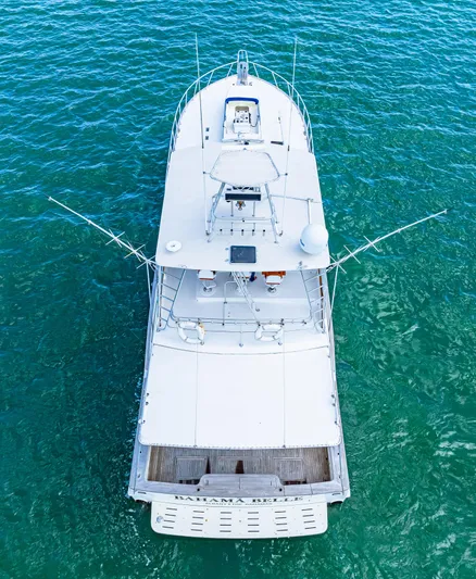 Bahama Belle Yacht Photos Pics Aerial view of a 1996 Blackwell 72 yacht on clear blue water.